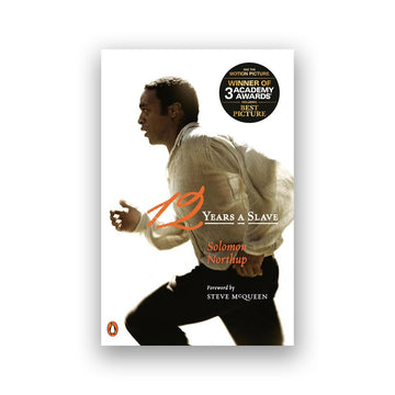 Book cover of '12 Years a Slave' with a silhouette of a man running, featuring the author's name and a award badge. movie tie-in book